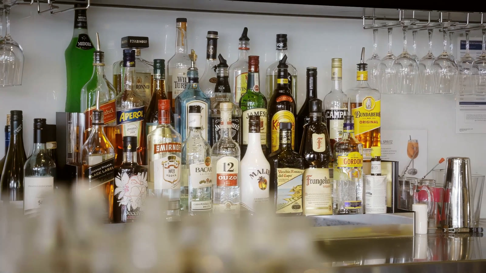 The bar at Oar Glenunga, stocked with spirits, wine and glasses